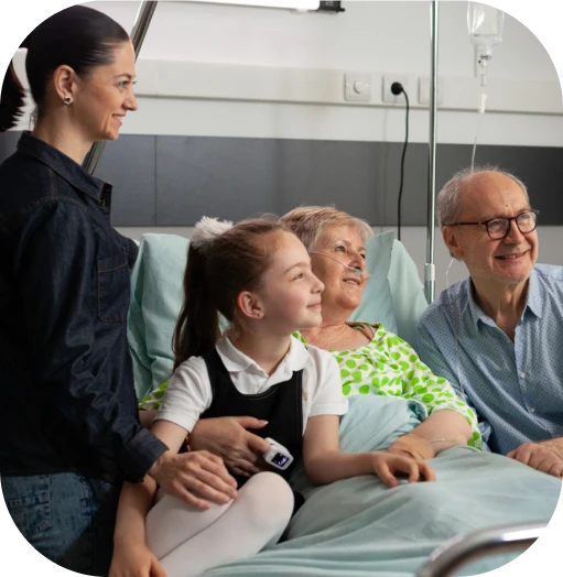A family visiting an elderly relative in the hospital, showing support during a health crisis